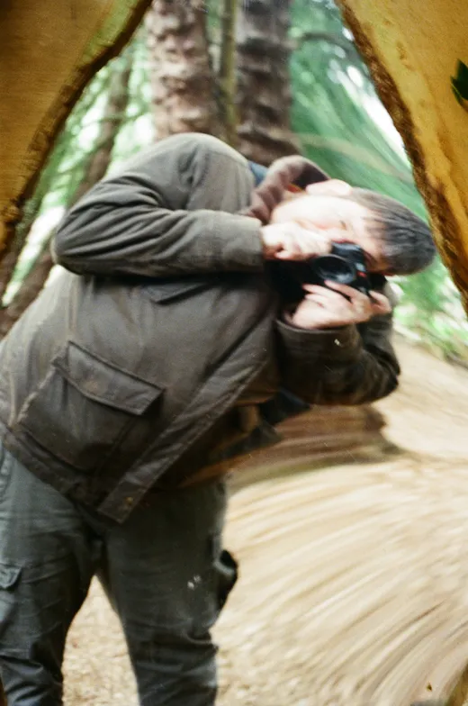 mallchin, leaning into a camera in the woods